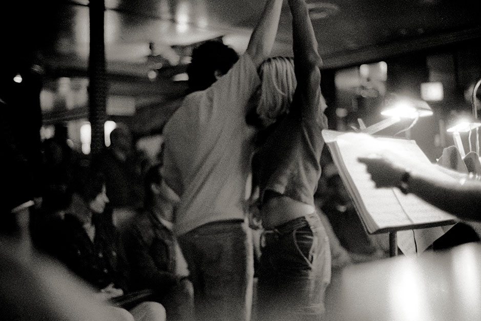 A man and a woman dance in the crowded club.