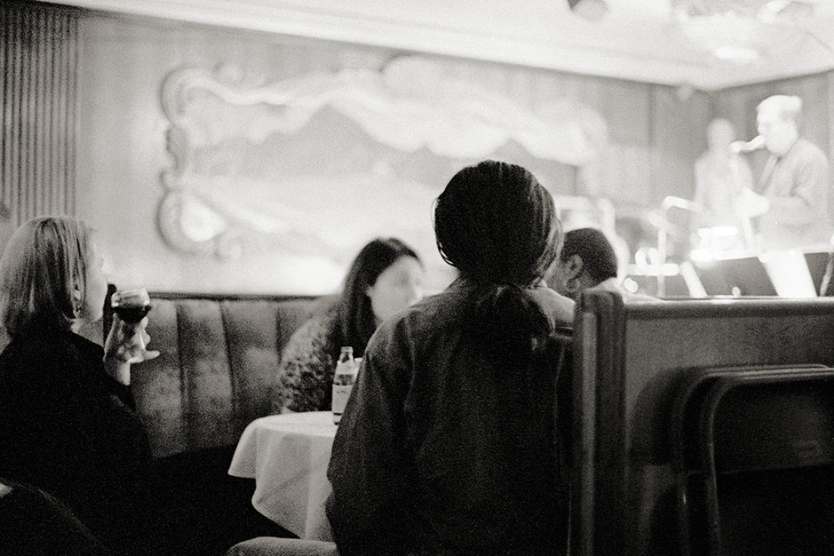 A group of friends sits, talking.
